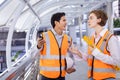 Team of diversity engineer is using walkie talkie while inspecting the construction project for modern architecture and real Royalty Free Stock Photo