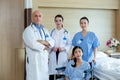 Team of doctor and patient in room at hospital