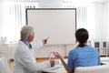 Team of doctors looking at projection screen Royalty Free Stock Photo