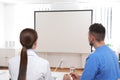 Team of doctors looking at projection screen Royalty Free Stock Photo