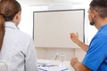 Team of doctors looking at projection screen Royalty Free Stock Photo