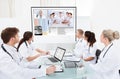 Team of doctors looking at projector screen Royalty Free Stock Photo