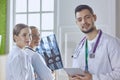 Team of doctors watching x-ray image in a hospital