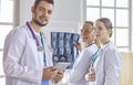 Team of doctors watching x-ray image in a hospital Royalty Free Stock Photo
