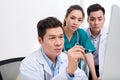 Team of doctors working and having on laptop in medical office Royalty Free Stock Photo