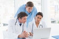 Team of doctors working on laptop computer Royalty Free Stock Photo