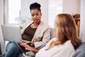 This is the team that drives success. two attractive young businesswomen sitting in the office together and using Royalty Free Stock Photo