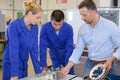Team electronic apprentices assembling machine Royalty Free Stock Photo
