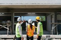 team engineer, foreman, architect meeting for colleagues discussing and checks construction blueprints at onsite Royalty Free Stock Photo