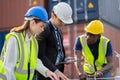 Team engineers discussing new project about to invest in install solar cells outside building or industrial factory Royalty Free Stock Photo