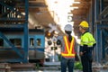 A team of engineers goes to the actual site as the train passes by to inspect and analyze the unfinished railway station Royalty Free Stock Photo