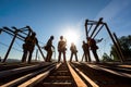 A team of engineers inspecting the foundation of a bridge under construction