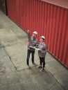 A team of engineers talks to managers at the Container cargo