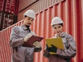 A team of engineers talks to managers at the Container cargo