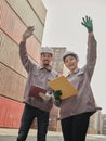 A team of engineers waving hand to say hello, greeting someone
