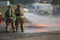 Firefighters train on extinguishing fuel spill fire.