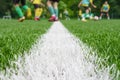 Team on football ground. Match training school soccer field lines. Young footballers on pitch playing football court Royalty Free Stock Photo