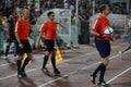 A team of football referees out on the field before the match
