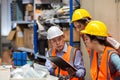 Team Foreman or Team worker working in warehouse. Industrial and industrial workers concept. worker woman order details and checki