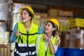 Team Foreman or Team worker working in warehouse. Industrial and industrial workers concept. worker woman order details and checki