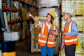 Team Foreman or Team worker working in warehouse. Industrial and industrial workers concept. worker woman order details and checki