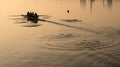 Team of four rowers practice in racing canoe