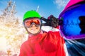 Team friends makes selfie photo of herself with snowboards and skis. Action camera