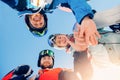 Team of friends man and woman skiing and snowboard make selfie photo in winter with sun light on ski resort Royalty Free Stock Photo