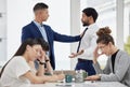 Team, frustrated and business people with conflict in office with problem, crisis and stressed out in meeting. Fight Royalty Free Stock Photo