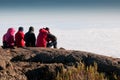 Team gazing over clouds