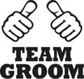 Team groom with two thumbs