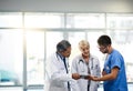 Team or group of doctors, nurses and medical professional talking, meeting and discussing healthcare in a hospital Royalty Free Stock Photo