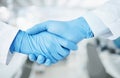 Team handshake, gloves and lab scientist partnership, agreement or collaboration on medical healthcare project Royalty Free Stock Photo