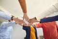 Low angle group shot of happy business people standing in circle and joining hands Royalty Free Stock Photo