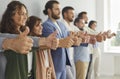 Team of happy business people standing in row and showing thumbs up gesture all together Royalty Free Stock Photo