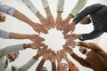 Team of happy diverse people joining hands to show concept of community and teamwork Royalty Free Stock Photo