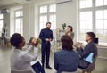 Team of happy multiracial men and women applauding a professional business coach Royalty Free Stock Photo
