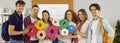 Team of happy students connecting gears illustrating concept of teamwork in education Royalty Free Stock Photo
