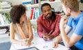 Team of happy successful architects working on construction plans in office. Royalty Free Stock Photo