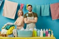 Team of hardworking cleaners standing with crossed arms behind the table