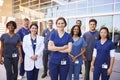 Team of healthcare workers with ID badges outside hospital Royalty Free Stock Photo