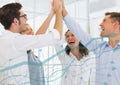 Team highfiving and light blue graph Royalty Free Stock Photo