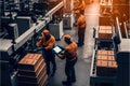 A team of human and robotic workers collaborating to produce a product on a factory . Ai Generative
