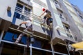 Team of industrial climbers at work, they are washing building f Royalty Free Stock Photo