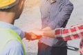 Team of industrial worker stacking hand show power and trust in site construction Royalty Free Stock Photo