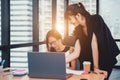 Team job. Photo young businessmans crew working with new startup project in modern loft. Generic design notebook on wood table Royalty Free Stock Photo