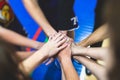 Team of kids children basketball players stacking hands in the court, sports team together holding hands getting ready for the Royalty Free Stock Photo