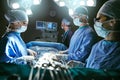 The team that knows what theyre doing. surgeons in an operating room.