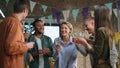Team laughing corporate party clinking champagne glasses. Colleagues drinking Royalty Free Stock Photo