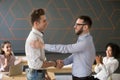 Team leader handshaking employee congratulating with professiona Royalty Free Stock Photo